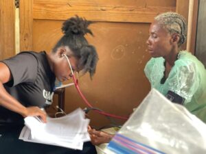 a haitian doctor examines a patient